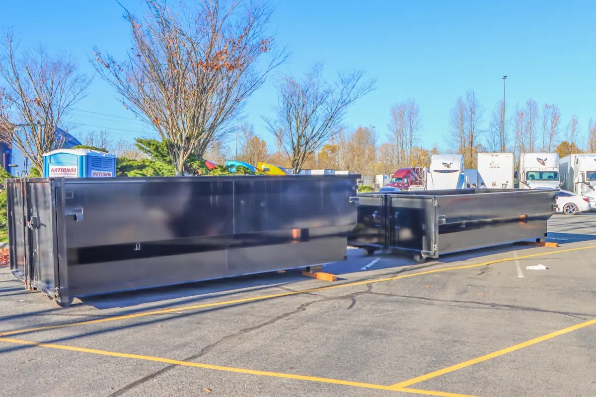 Professional dumpster rental service with roll-off container on residential driveway in Parsippany-Troy Hills